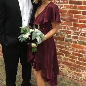 A Zimmermann Ready to Wear Wrap dress in Burgundy.